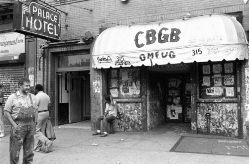 Hilly Kristal (far left) in front of his club, CBGB, 1987 © Ebet Roberts