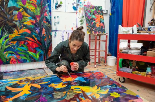 The artist Orlanda Broom painting in her studio.
